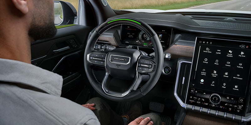 2027 GMC Acadia Denali cockpit with Super Cruise and 15-inch Infotainment screen