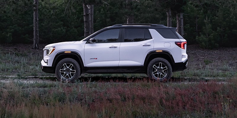 2027 GMC Terrain AT4 side profile showing 17-inch Dark Machined wheels and all-terrain tires