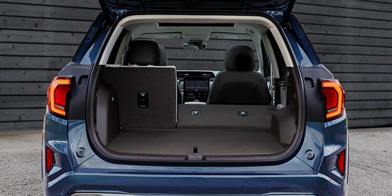 2027 GMC Terrain rear cargo area with 60/40 split-folding second-row seats showing up to 63.5 cu. ft. of cargo space