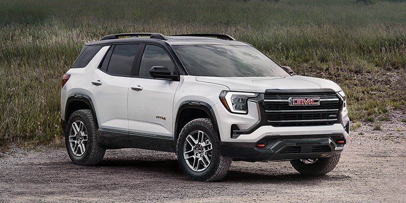 2027 GMC Terrain AT4 parked on a gravel mountain trailhead in Wyoming