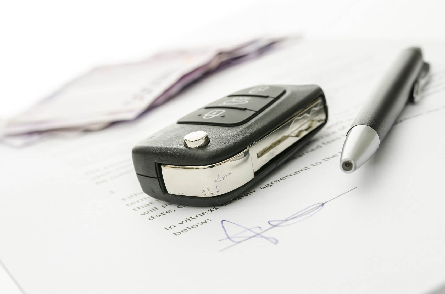 Financing paper with car keys